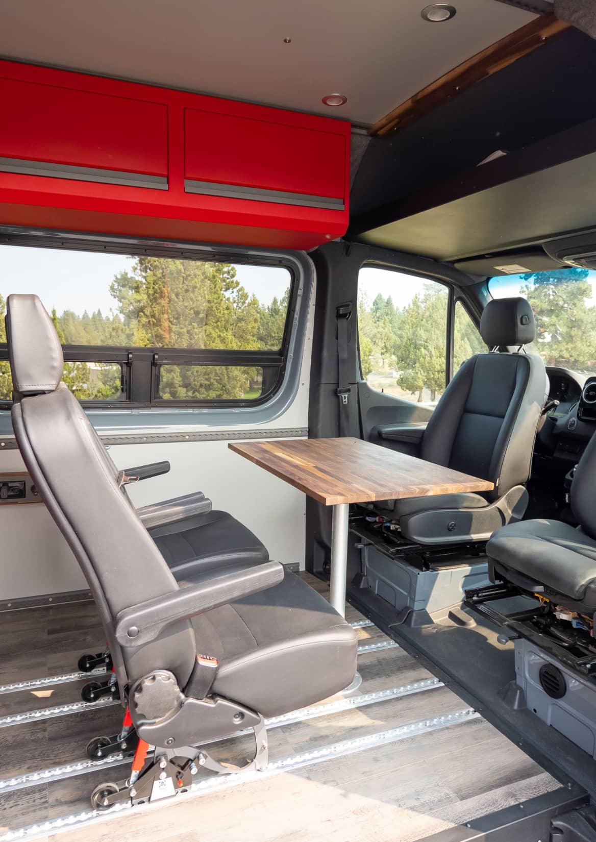 A van inside with red Esplori cabinets