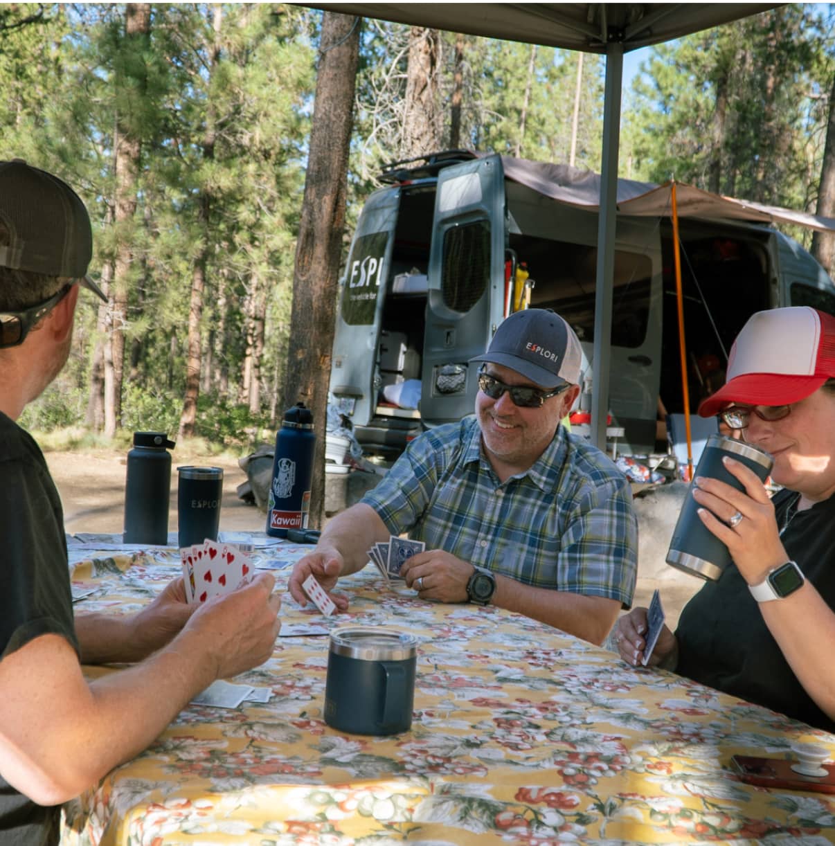 Esplori team playing cards in the forrest